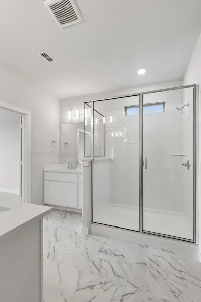 Primary Bathroom in the Winters home plan by Trophy Signature Homes – REPRESENTATIVE PHOTO