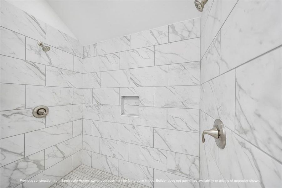 Shower in Style: Revel in the expansiveness of a large shower, standard with sleek finishes and dual shower heads, providing plenty of space for shared morning routines.