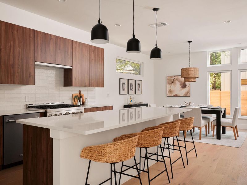 Kitchen with decorative light fixtures, light wood-style floors, tasteful backsplash, a center island, and recessed lighting Kitchen with decorative light fixtures, light wood-style floors, tasteful backsplash, a center island, and recessed lighting