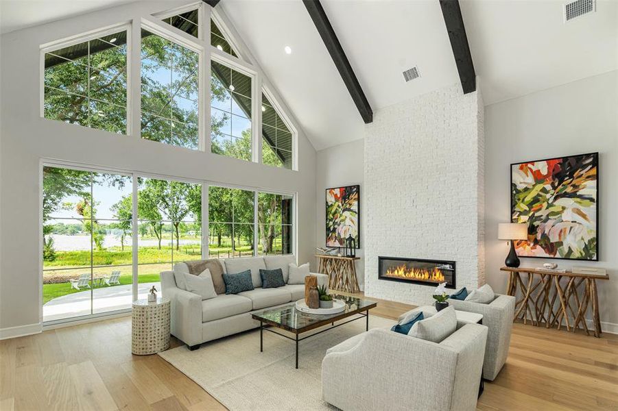 Lake views, fireplace, hardwoods, 17+ ceiling heights, double sliding doors leading to your outdoor oasis Lake views, fireplace, hardwoods, 17+ ceiling heights, double sliding doors leading to your outdoor oasis