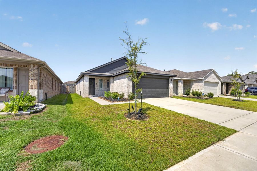 Additional exterior view highlights the home's brick façade, front lawn and attractive single-story design. Additional exterior view highlights the home's brick façade, front lawn and attractive single-story design.