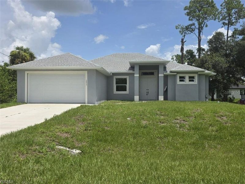 Front exterior of a new home in , Fort Myers, FL, highlighting curb appeal (Image 15).