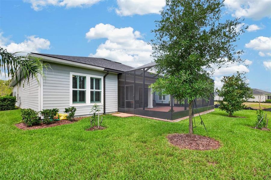 Exterior details and patio area of a home in Reverie at Palm Coast, Palm Coast (Image 26).