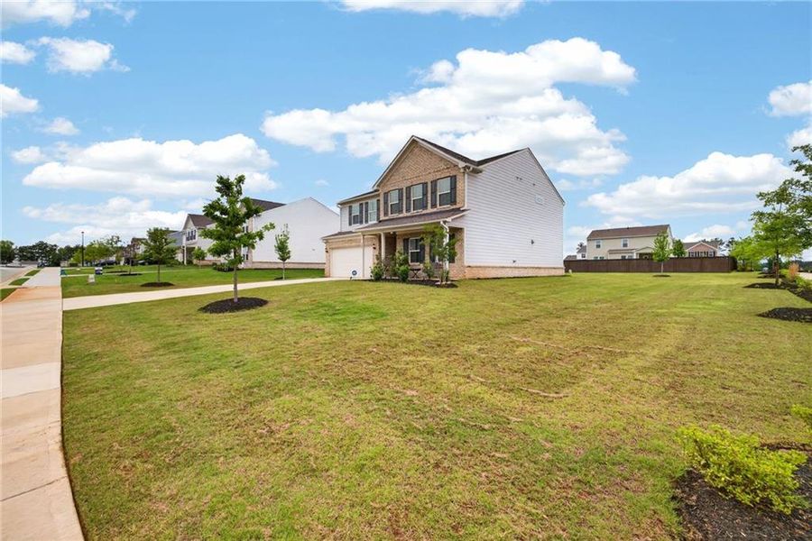 Front exterior of a new home in , McDonough, GA, highlighting curb appeal (Image 27).