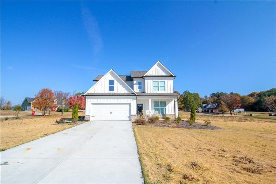 Front exterior of a new home in , Commerce, GA, highlighting curb appeal (Image 18).