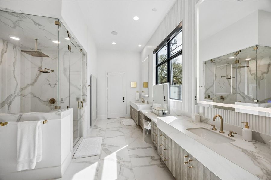 The primary bathroom has 3 program lighting on each over the sink mirror. There is also a commercial grade full length trip fold mirror in the corner of the bathroom closest to the largest of the two closets. The larger closet contains a clothing closet, a shoe closet, and a purse closet. It is a massive space and will be locked for showings but photos can be provided. The closet can be opened for a second showing. The primary bathroom has 3 program lighting on each over the sink mirror. There is also a commercial grade full length trip fold mirror in the corner of the bathroom closest to the largest of the two closets. The larger closet contains a clothing closet, a shoe closet, and a purse closet. It is a massive space and will be locked for showings but photos can be provided. The closet can be opened for a second showing.