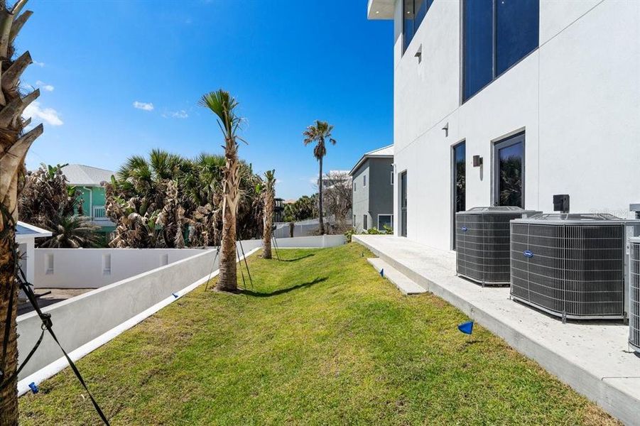 Exterior details and patio area of a home in , New Smyrna Beach (Image 36).