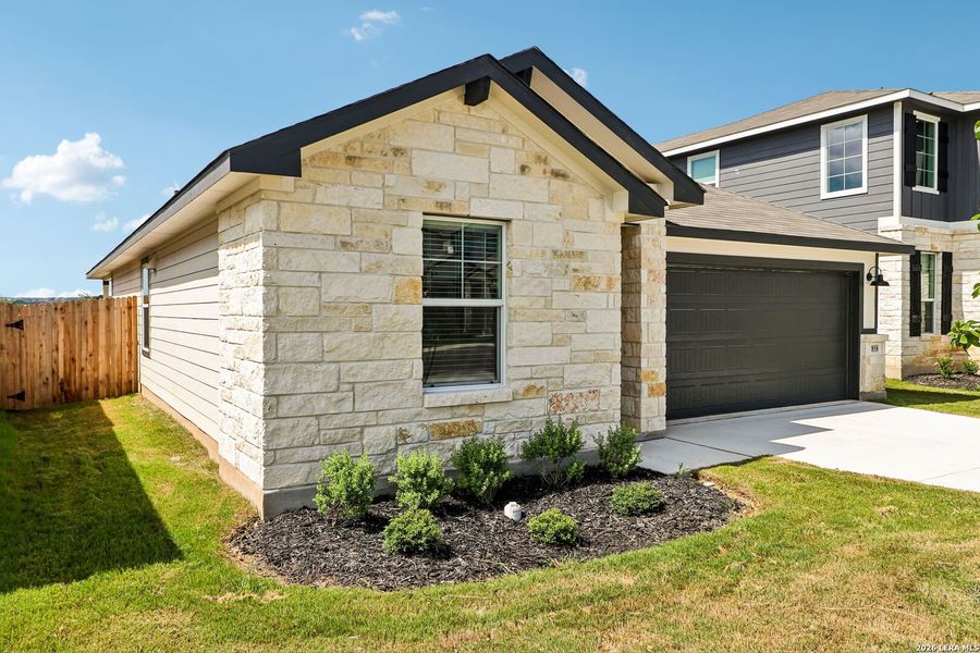 Front exterior of a new home in Estancia Ranch - Premier Series, San Antonio, TX, highlighting curb appeal (Image 23). Front exterior of a new home in Estancia Ranch - Premier Series, San Antonio, TX, highlighting curb appeal (Image 23).
