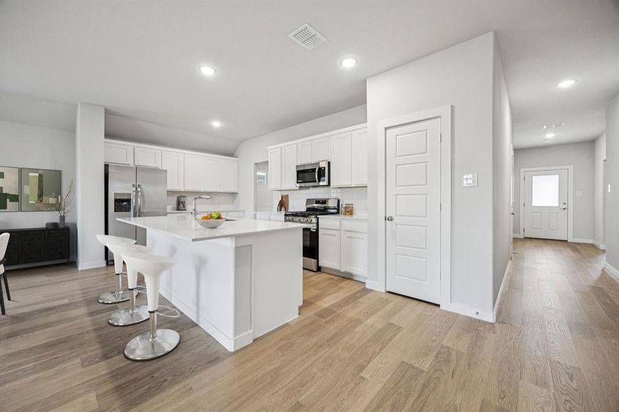 Kitchen in the Harrison home plan by Trophy Signature Homes – REPRESENTATIVE PHOTO