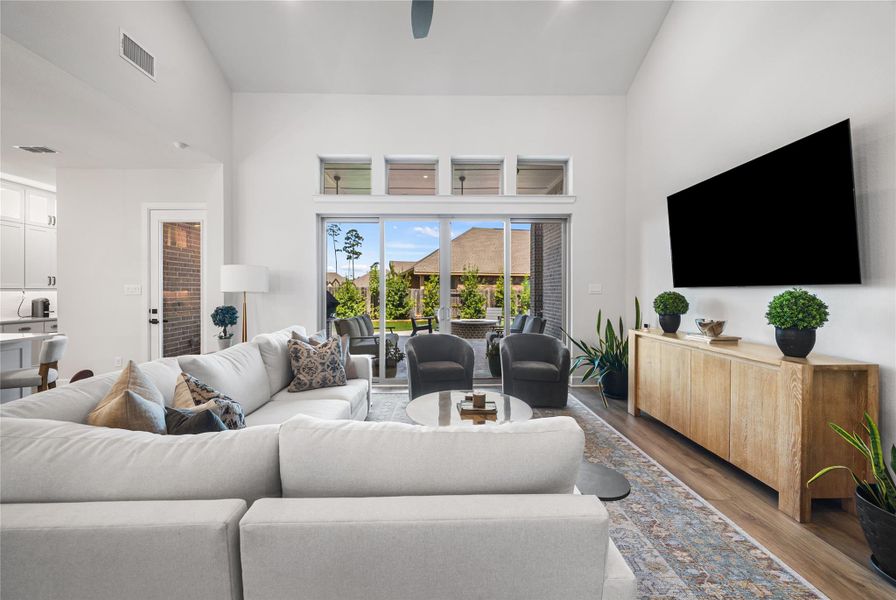 Spacious and inviting living area with abundant natural light and sliding glass doors providing seamless access to the outdoor living space