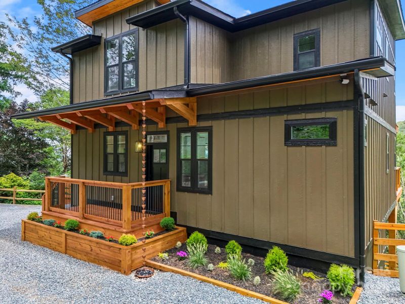 Front exterior of a new home in , Seven Devils, NC, highlighting curb appeal (Image 21).