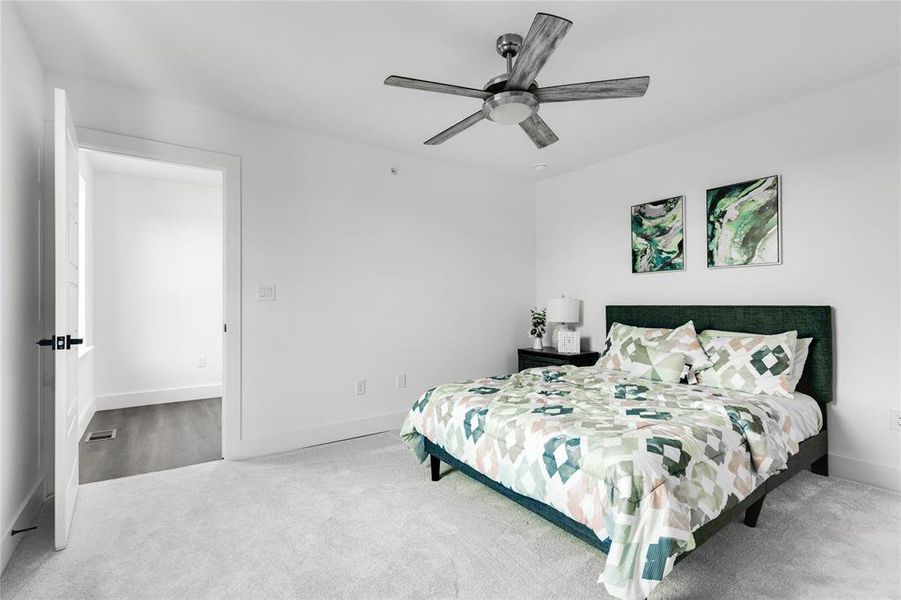 Bedroom with carpet flooring and ceiling fan