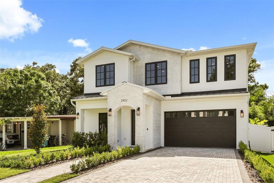 Front exterior of a new home in College Park, Orlando, FL, highlighting curb appeal (Image 2). Front exterior of a new home in College Park, Orlando, FL, highlighting curb appeal (Image 2).