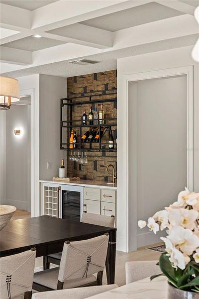 Custom wet bar with sink and wine fridge Custom wet bar with sink and wine fridge