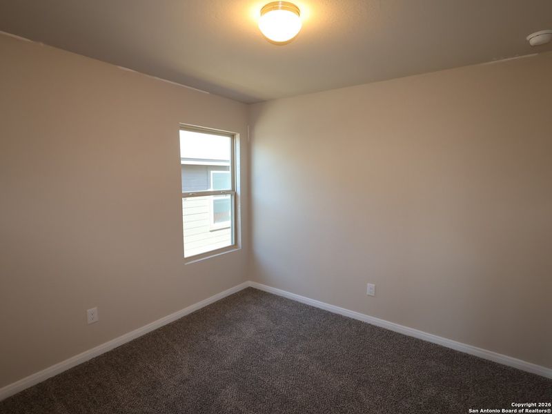Spacious, unfurnished interior of a new home in Hunters Ranch, San Antonio (Image 22).