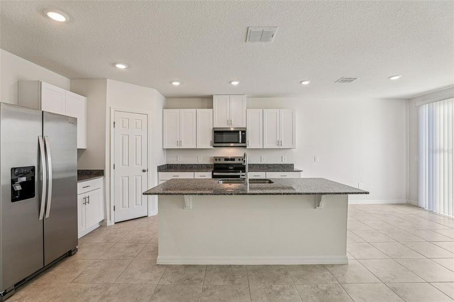 Furnished interior view inside a new home in Lawson Dunes - Signature Series, Haines City (Image 7). Furnished interior view inside a new home in Lawson Dunes - Signature Series, Haines City (Image 7).