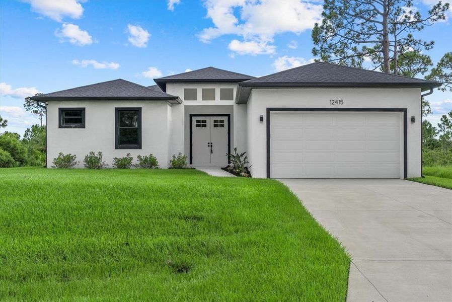 Front exterior of a new home in , Port Charlotte, FL, highlighting curb appeal (Image 21). Front exterior of a new home in , Port Charlotte, FL, highlighting curb appeal (Image 21).