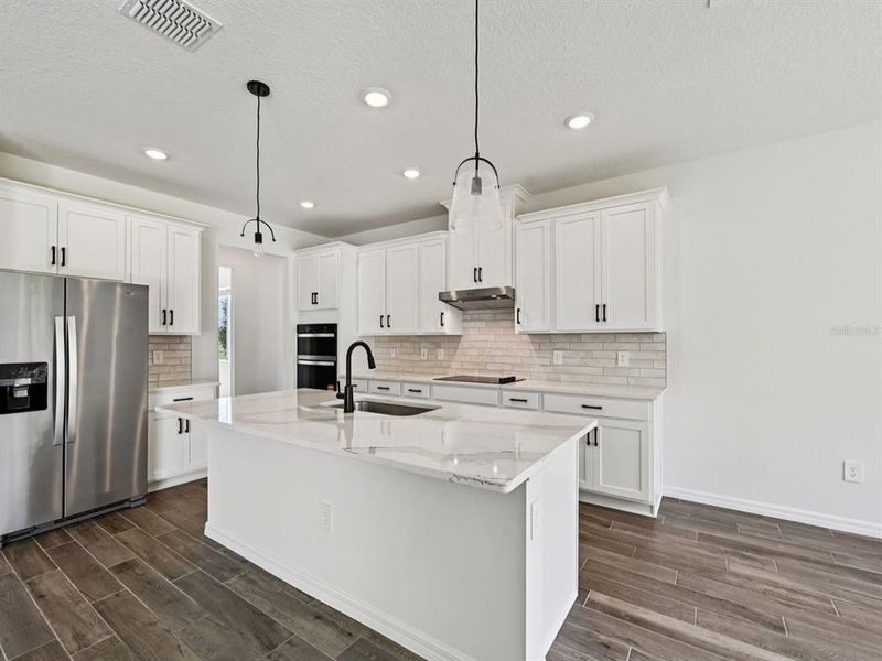Furnished interior view inside a new home in Oakfield Trails - Premier Series, Parrish (Image 4).