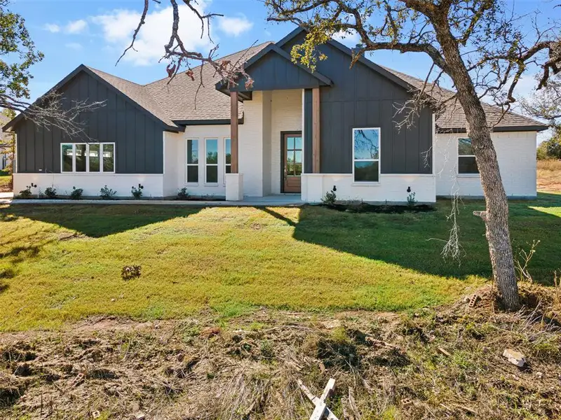 Front exterior of a new home in Lucky Ridge, Boyd, TX, highlighting curb appeal (Image 1). Front exterior of a new home in Lucky Ridge, Boyd, TX, highlighting curb appeal (Image 1).