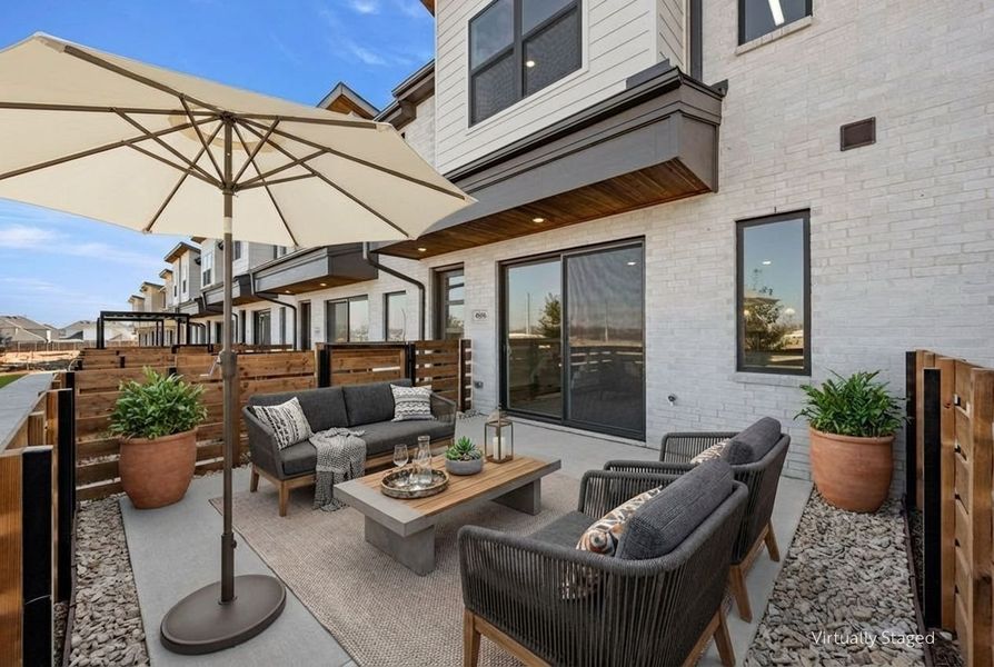 Exterior details and patio area of a home in Wildridge, Oak Point (Image 3).