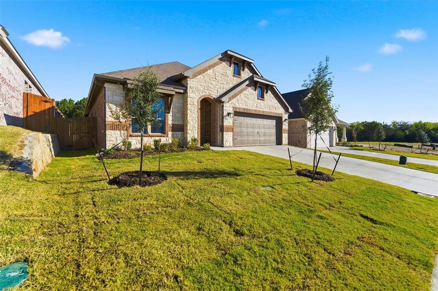 Front exterior of a new home in Waterford Park, Weatherford, TX, highlighting curb appeal (Image 1). Front exterior of a new home in Waterford Park, Weatherford, TX, highlighting curb appeal (Image 1).
