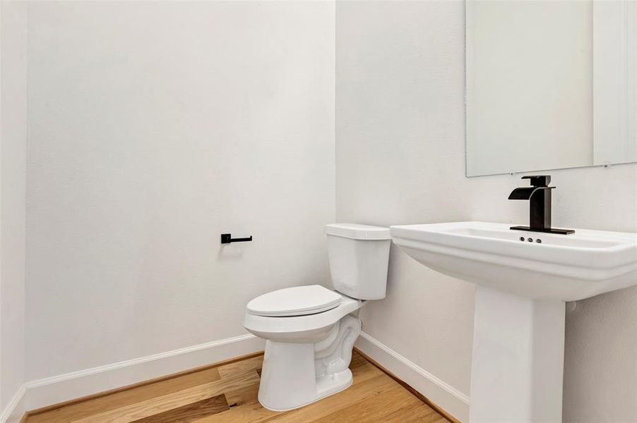 A half bathroom is conveniently located on the second floor. (Model Unit 9424C)