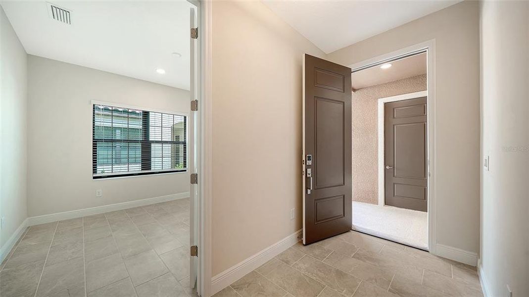 Spacious, unfurnished interior of a new home in Vicenza Real Estate and Homes for Sale in North Venice, FL - Neal Communities, Nokomis (Image 30).