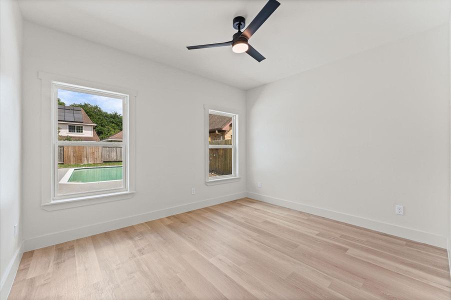 Bedroom # 3 is in the rear of the home with views of the pool.
