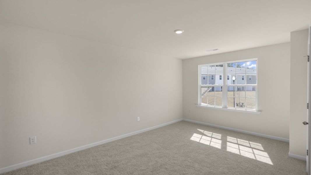 Representative unfurnished interior of a home built from the Pearson by D.R. Horton in The Townes at Ridgewood Farms, Winterville (Image 19).