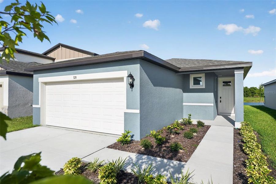 Front exterior of a new home in Magnolia Bay - Premier Series, Nokomis, FL, highlighting curb appeal (Image 27). Front exterior of a new home in Magnolia Bay - Premier Series, Nokomis, FL, highlighting curb appeal (Image 27).