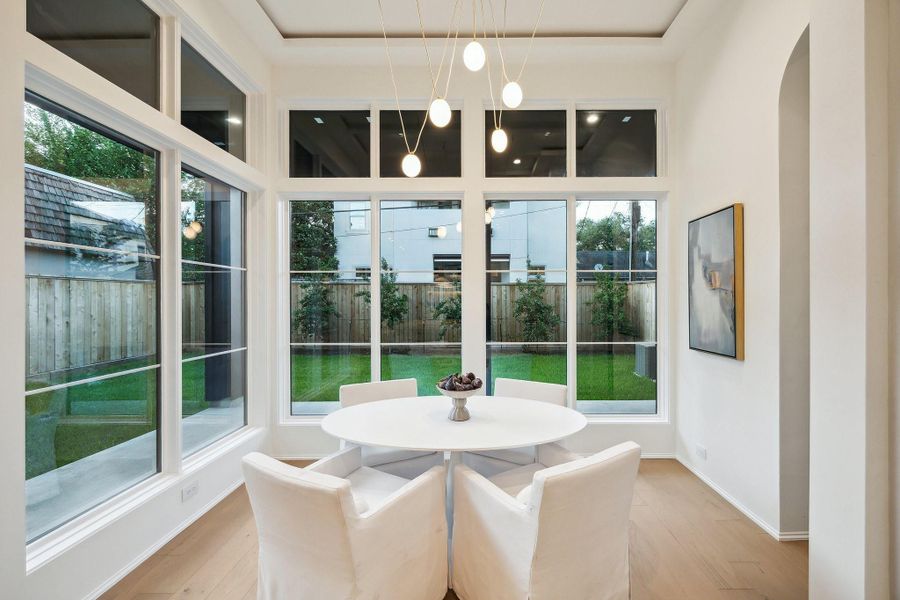 Light filled Breakfast Area with an Organic Modern Fixture. Light filled Breakfast Area with an Organic Modern Fixture.