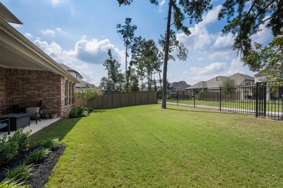 Front exterior of a new home in The Highlands: Pinnacle Collection, Porter Heights, TX, highlighting curb appeal (Image 2).