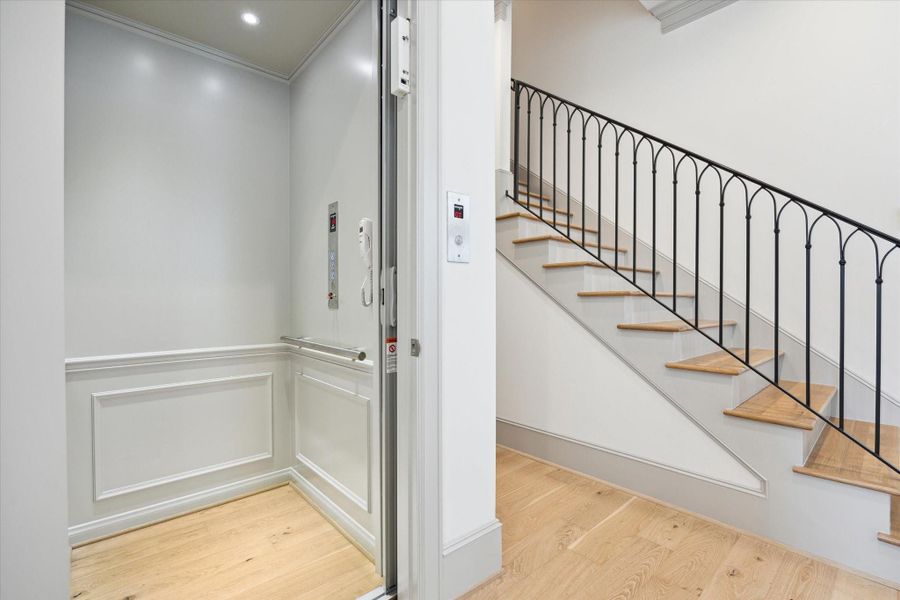 Elevator upgrade installed, services all three floors! Stairs lead to well appointed Primary-Suite and secondary bedrooms. Powder Bath down hall and storage closet under stairs.