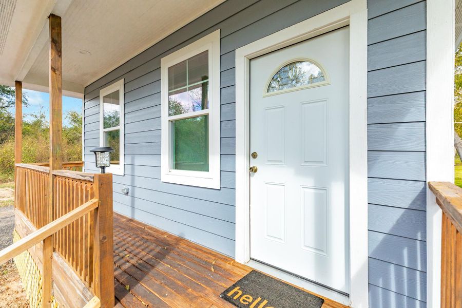 Enjoy peaceful mornings sipping coffee on the spacious front porch.