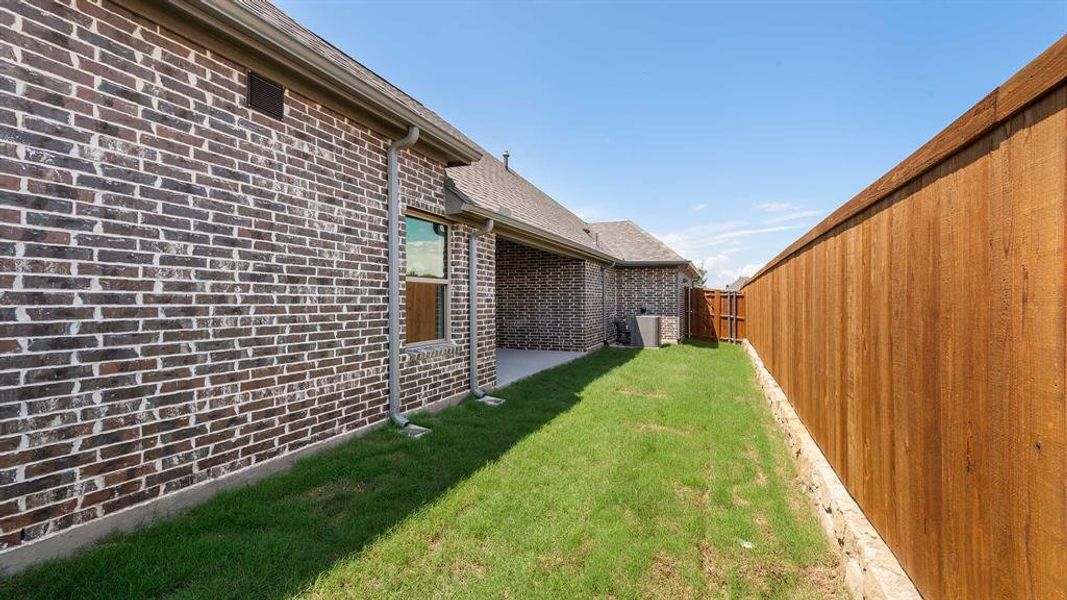 Front exterior of a new home in The Heights At Uptown Celina 45', Celina, TX, highlighting curb appeal (Image 2). Front exterior of a new home in The Heights At Uptown Celina 45', Celina, TX, highlighting curb appeal (Image 2).