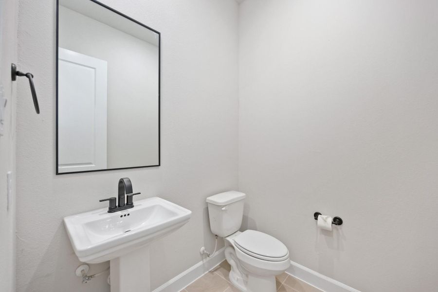 This powder bath may be petite, but it’s polished to perfection. With sleek fixtures and a splash of charm, it’s the kind of space guests will remember. This powder bath may be petite, but it’s polished to perfection. With sleek fixtures and a splash of charm, it’s the kind of space guests will remember.