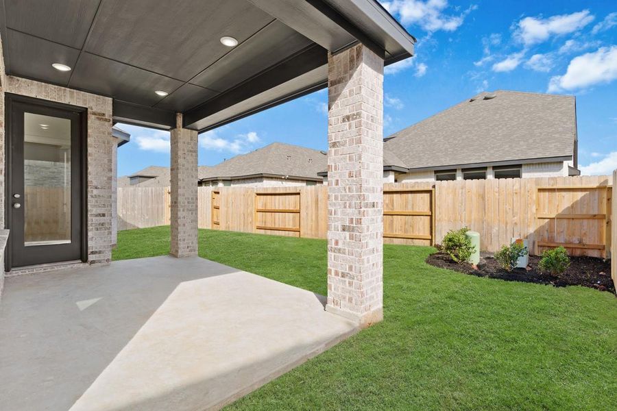 Exterior details and patio area of a home in Sunterra, Katy (Image 3).