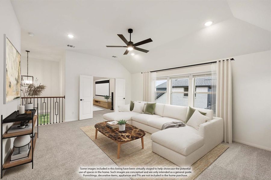 Upstairs living room with vaulted ceiling, ceiling fan, white sectional sofa, and carpet flooring Upstairs living room with vaulted ceiling, ceiling fan, white sectional sofa, and carpet flooring
