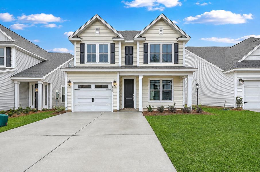 Front exterior of a new home in Windsor Crossing, North Charleston, SC, highlighting curb appeal (Image 1). Front exterior of a new home in Windsor Crossing, North Charleston, SC, highlighting curb appeal (Image 1).