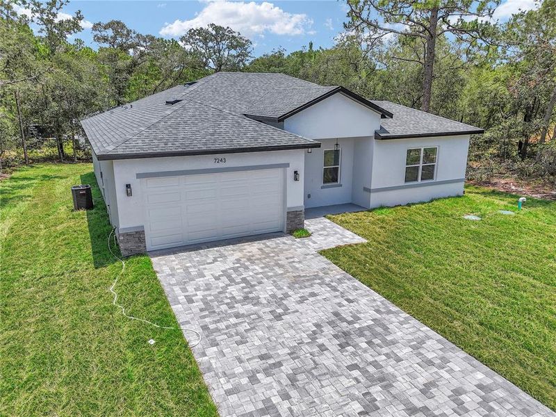 Front exterior of a new home in , Citrus Springs, FL, highlighting curb appeal (Image 22).