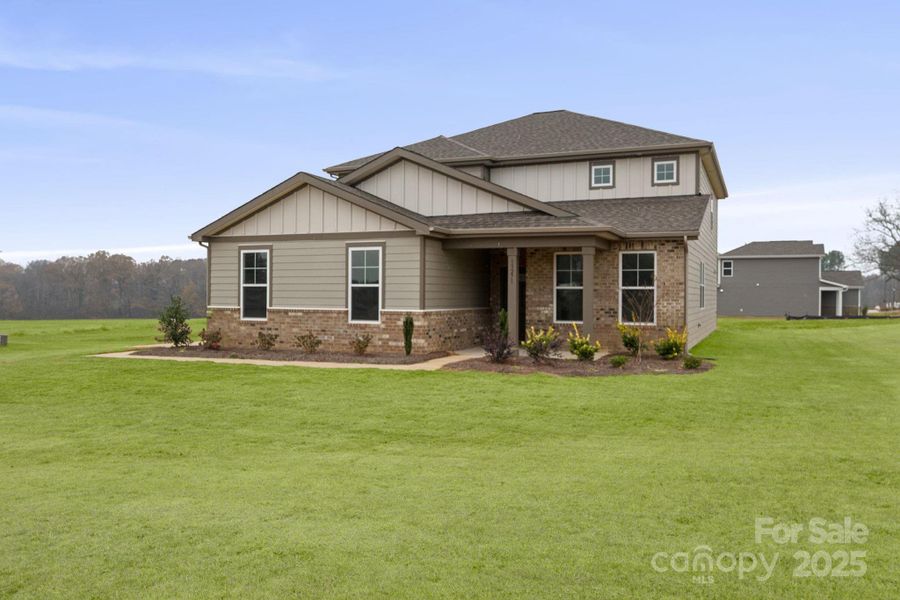 Front exterior of a new home in Running Creek, Locust, NC, highlighting curb appeal (Image 2). Front exterior of a new home in Running Creek, Locust, NC, highlighting curb appeal (Image 2).