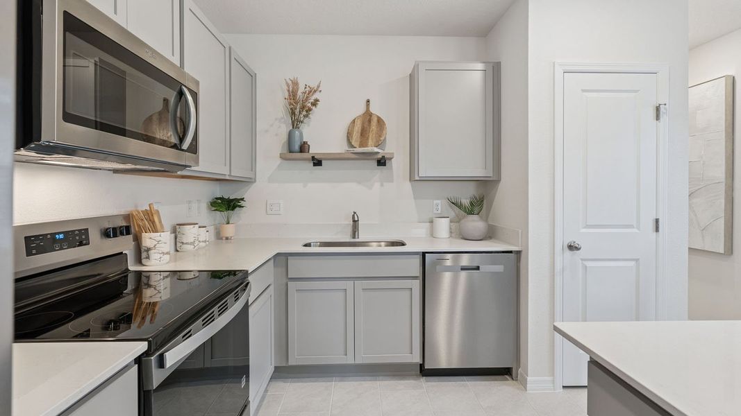 Representative furnished interior of a home built from the Downing II by D.R. Horton in Villamar, Winter Haven (Image 6).