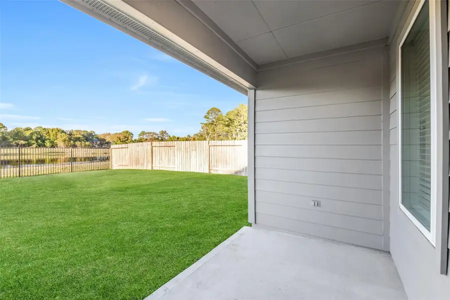 Exterior details and patio area of a home in Summerwood Trails, Willis (Image 4). Exterior details and patio area of a home in Summerwood Trails, Willis (Image 4).