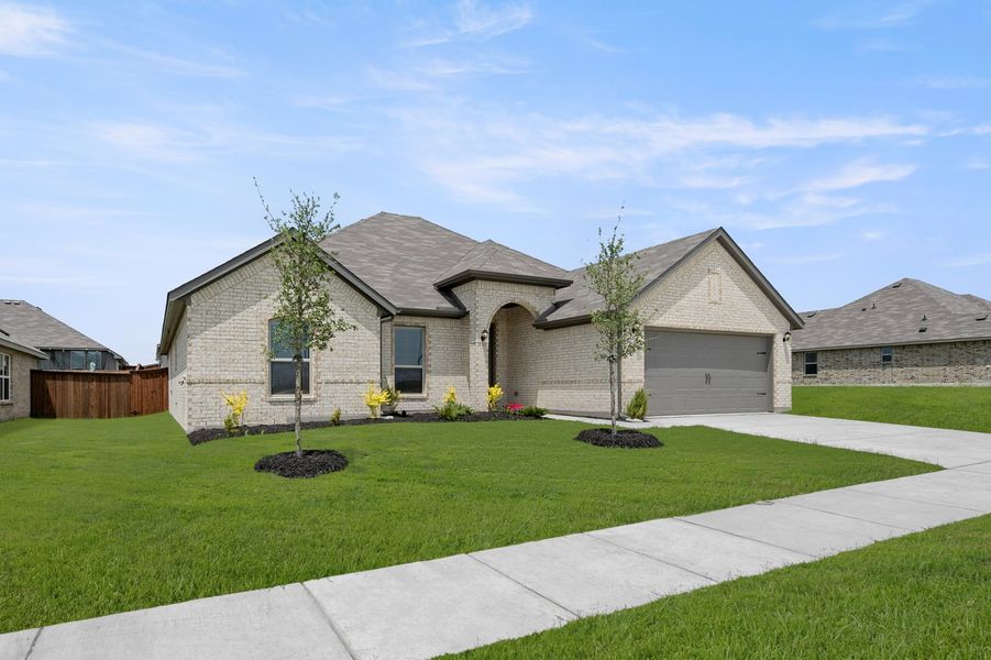 Front exterior of a new home in Still Water Lake Estates, Godley, TX, highlighting curb appeal (Image 4).