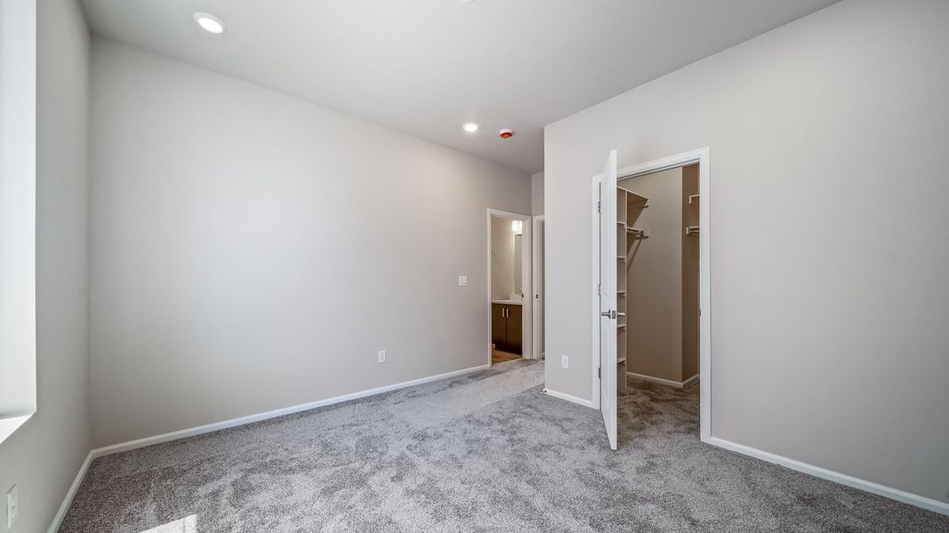 Spacious, unfurnished interior of a new home in The Reserve at Green Valley Ranch, Aurora (Image 26).