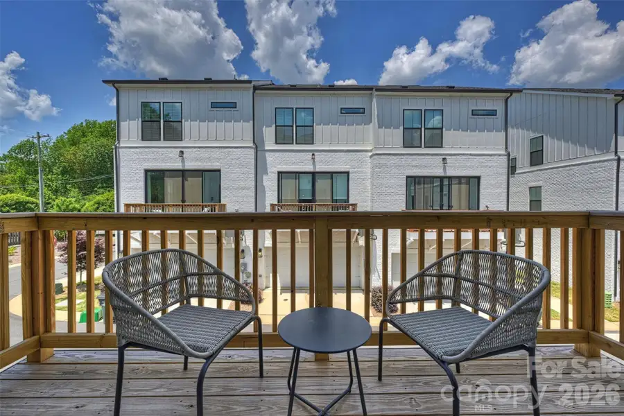 Exterior details and patio area of a home in The Townes of Cotswold, Charlotte (Image 4).
