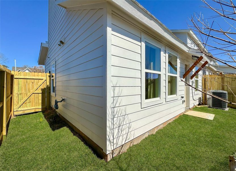Exterior details and patio area of a home in , Conroe (Image 27).