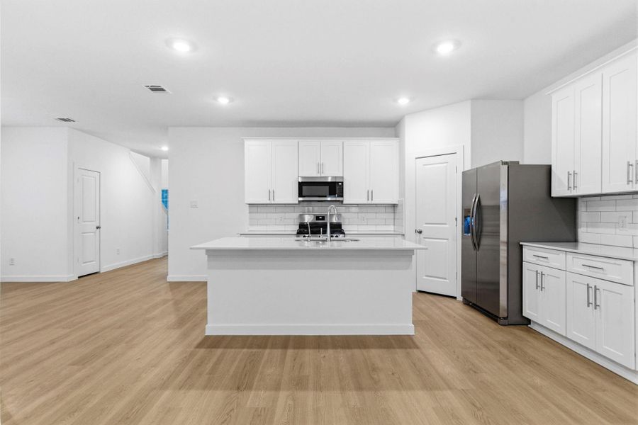 Furnished interior view inside a new home in Caldwell Crossing, Iowa Colony (Image 5).