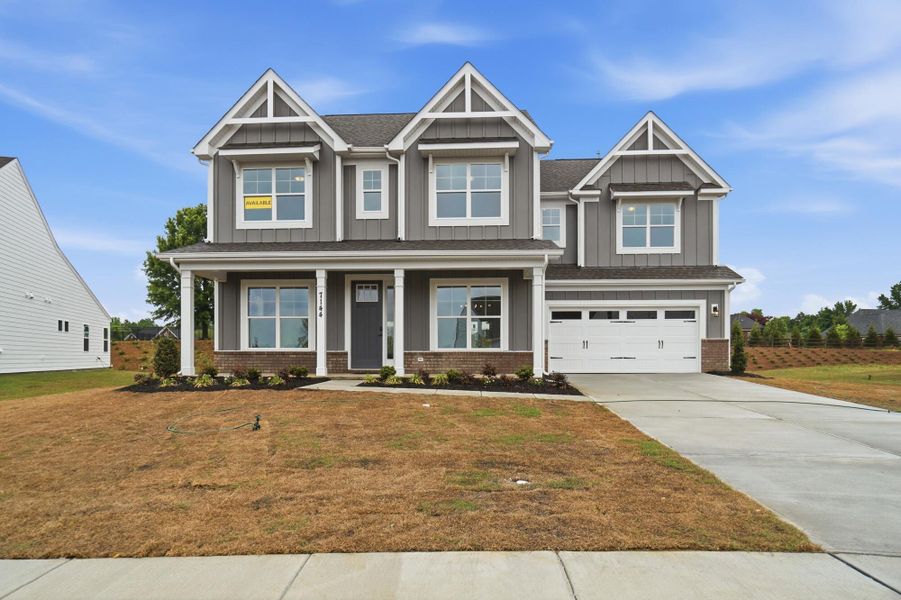 Front exterior of a new home in Harmony, Harrisburg, NC, highlighting curb appeal (Image 1). Front exterior of a new home in Harmony, Harrisburg, NC, highlighting curb appeal (Image 1).