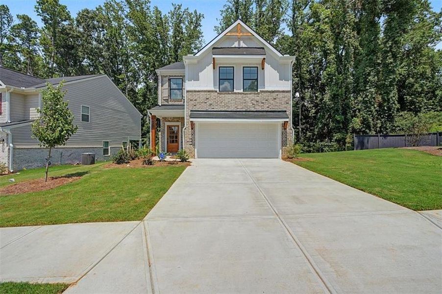 Front exterior of a new home in Sawmill Creek, Austell, GA, highlighting curb appeal (Image 25).